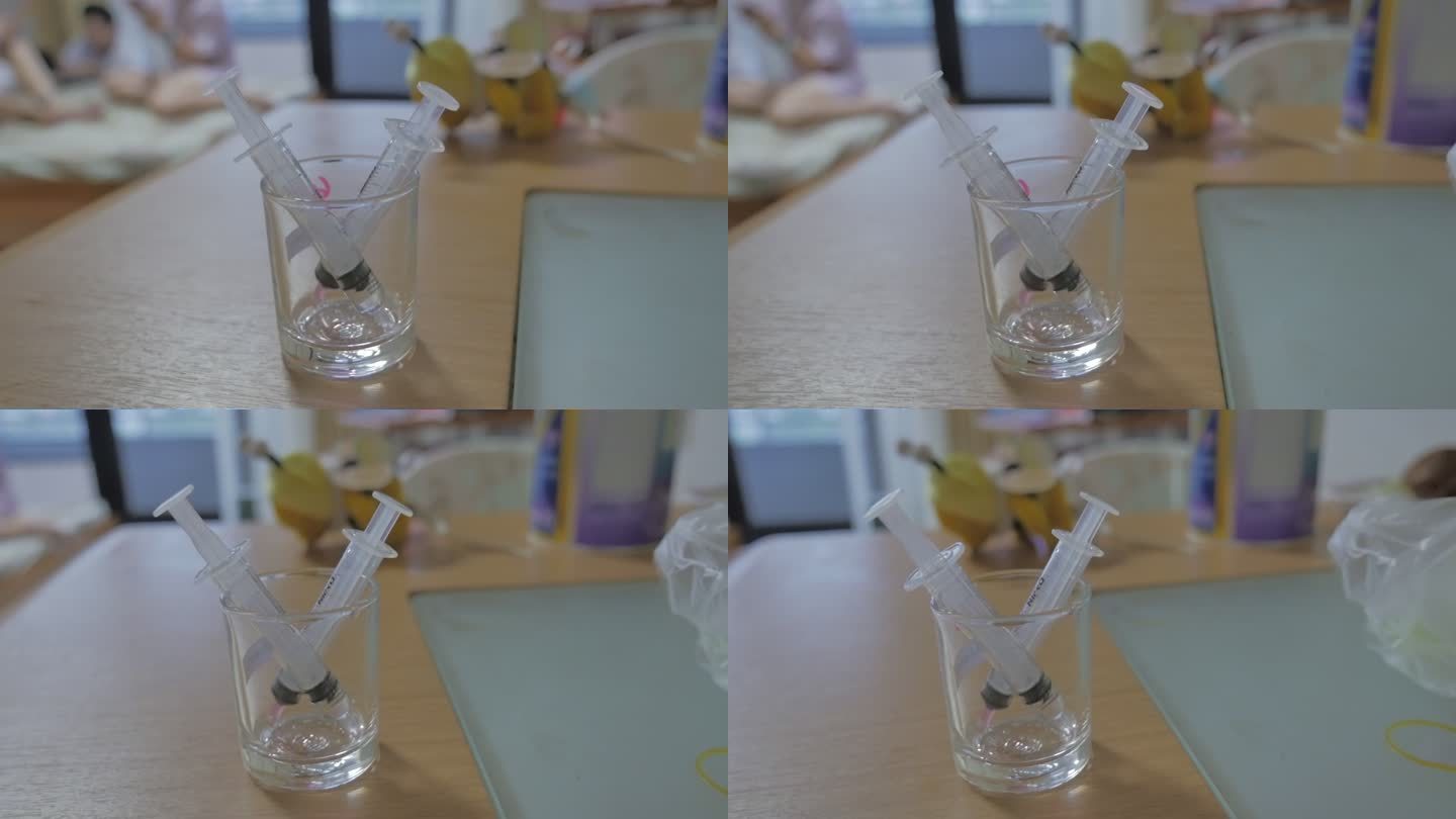 玻璃杯里的注射器，追踪镜头