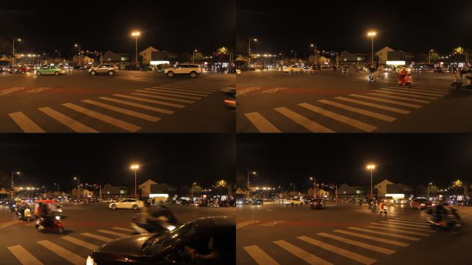 小镇夜晚十字路口延时拍摄汽车行人过马路