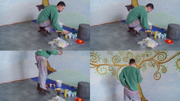 男人在家里刷墙涂鸦