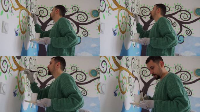 男子在墙上作画涂鸦