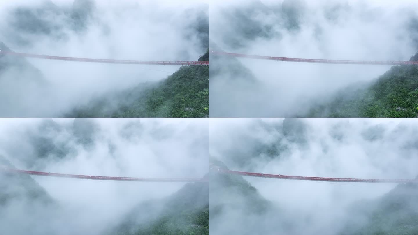 雨后云雾里桂林喀斯特山峰间横跨的铁索桥