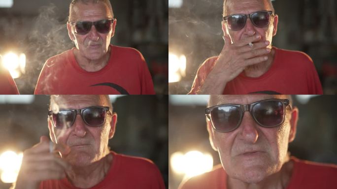 老年人抽烟看着镜头