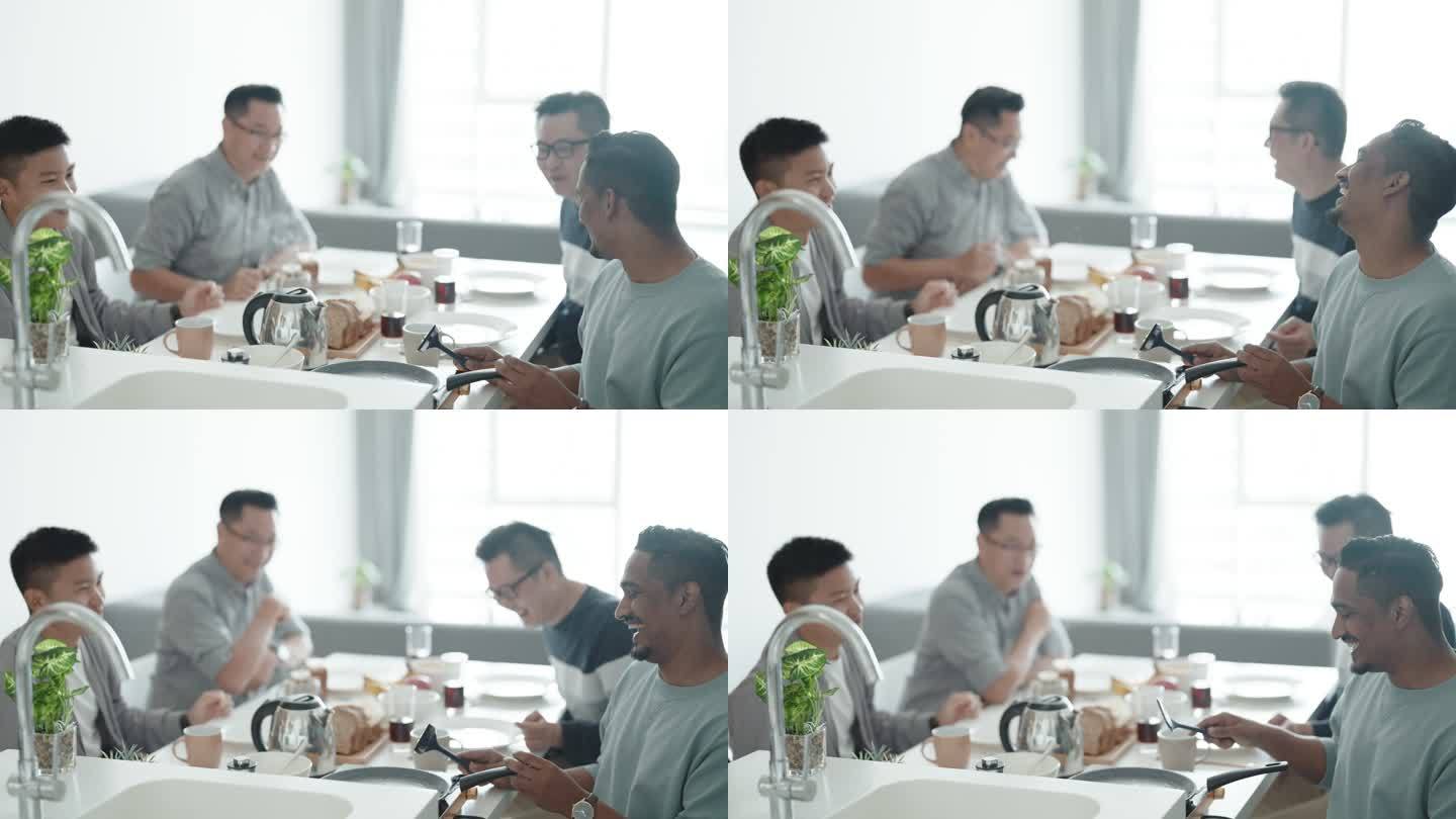 周末，一群亚洲男性朋友在公寓厨房做早餐