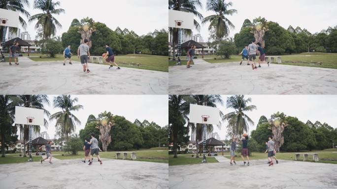 慢动作Z世代亚洲中国青少年男孩在周末早晨与朋友练习篮球比赛时阻挡挑战球员投篮