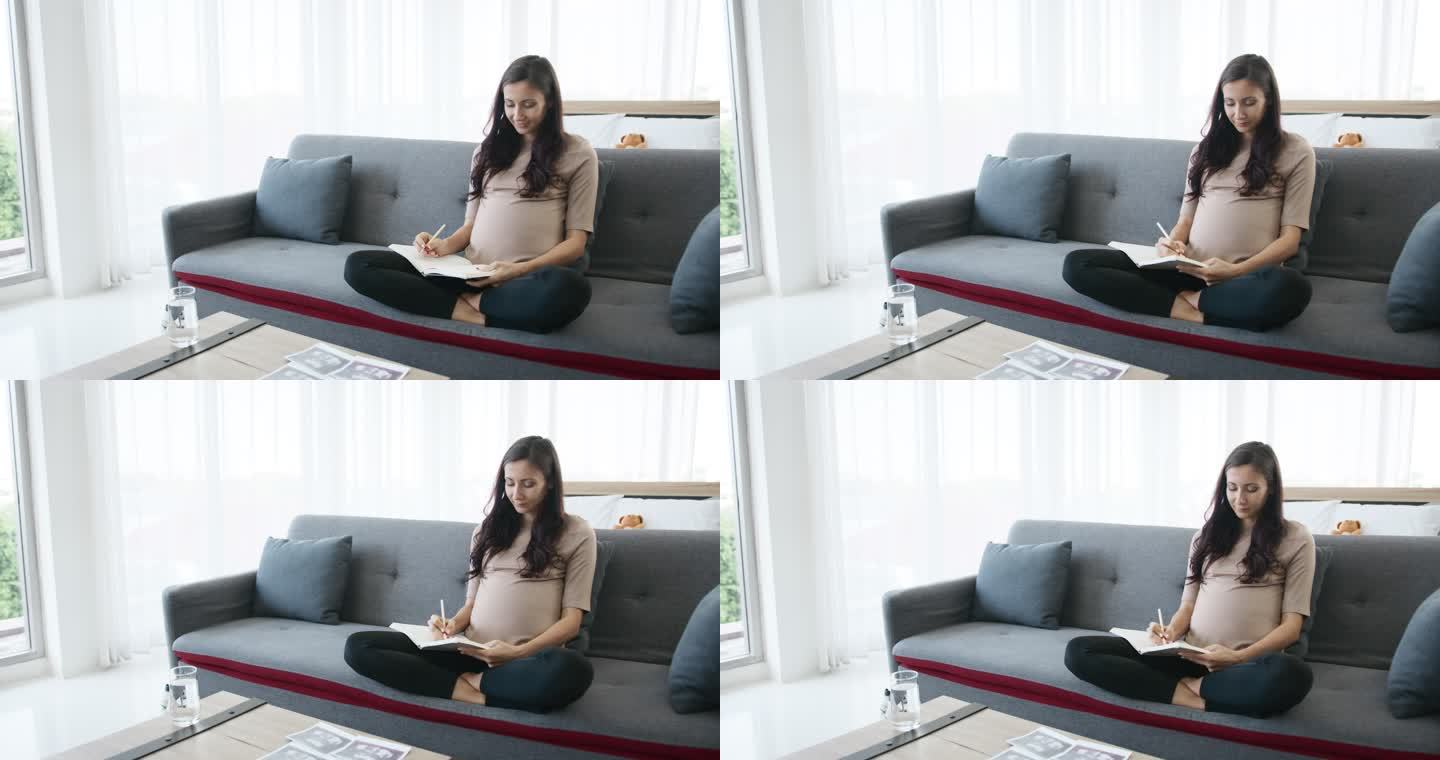 女性3D超声扫描孕妇沙发画画怀孕准备