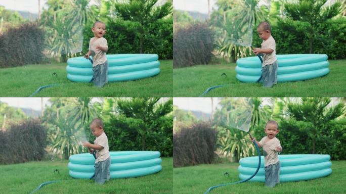 小男孩玩得很开心孩子戏水绿植宣传