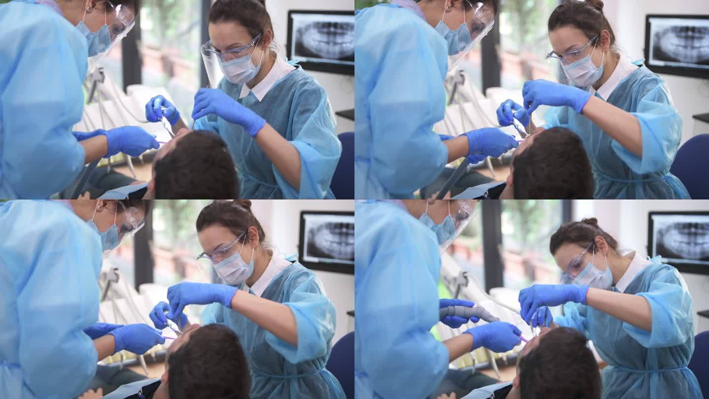 牙科医生和辅助治疗牙科诊所的患者。