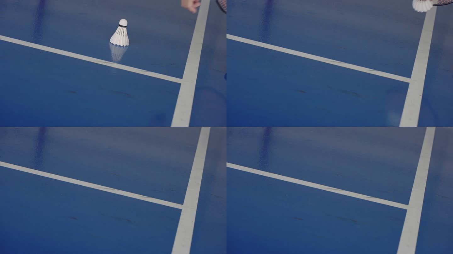 SLO MO：羽毛球运动员手持球拍，在体育馆地板上拿起羽毛球。