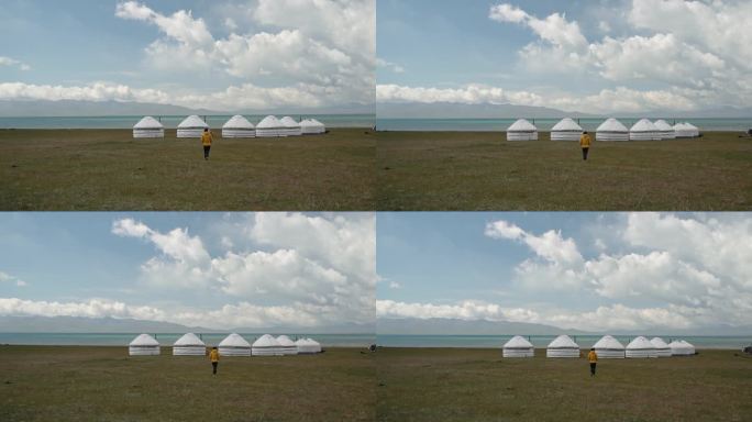 在吉尔吉斯斯坦Son Kul湖附近的蒙古包附近散步的妇女