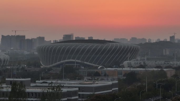 晚霞余晖下的武汉光谷国际网球中心航拍