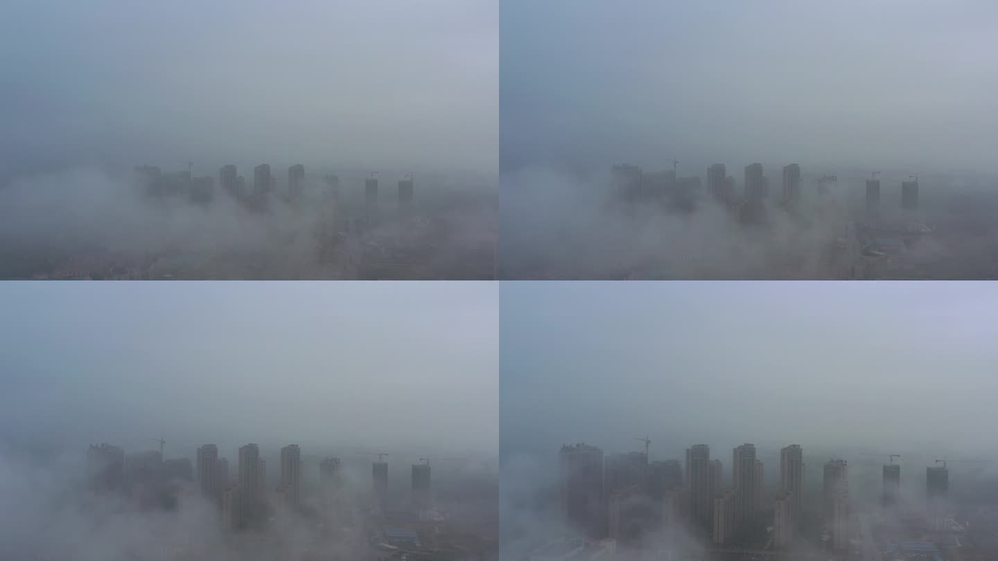 航拍雾天云端之上俯瞰城市建筑高楼