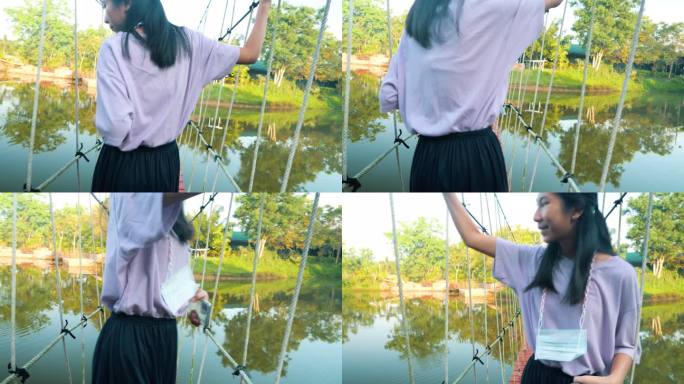 亚洲女孩早上走在湖上的长袍桥上，生活方式理念。