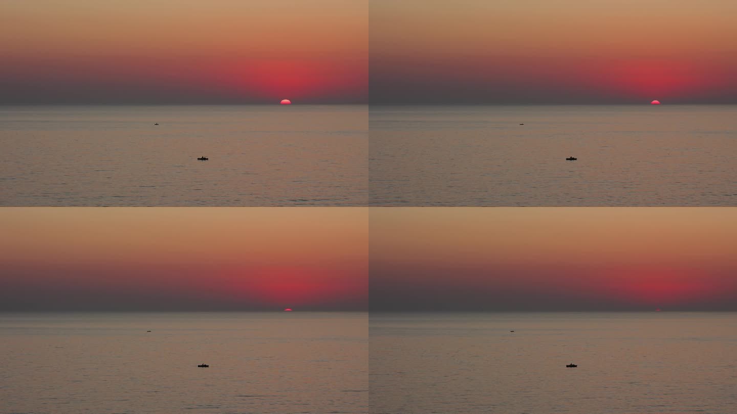 阿尔巴尼亚杜勒斯海滩的小船和海上的戏剧性日落