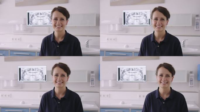 微笑美丽的女牙医在医疗诊所