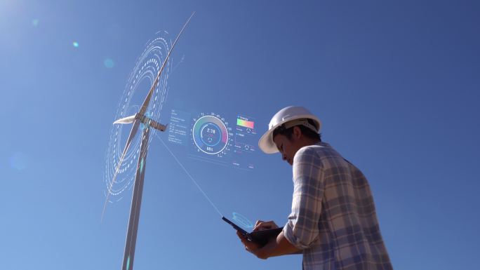 一名工程师在外面工作，控制风力涡轮机的能量。