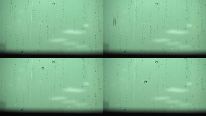 雨水溅到窗户上下雨滴玻璃窗车窗下雨天
