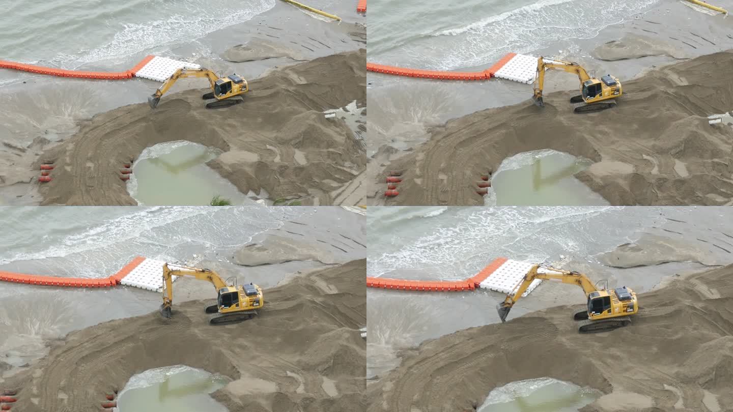 鸟瞰挖掘机正在改善海滩以保护海洋。