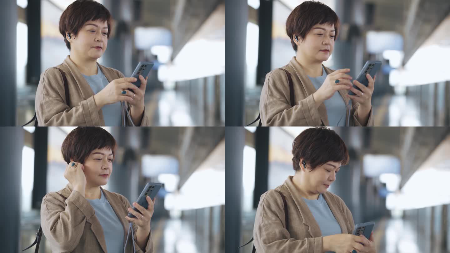 使用人脸识别技术的亚洲中国女子解锁手机并打开手机应用程序收听音乐