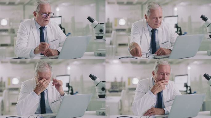一位科学家在现代实验室里使用笔记本电脑，看起来很紧张的4k视频片段