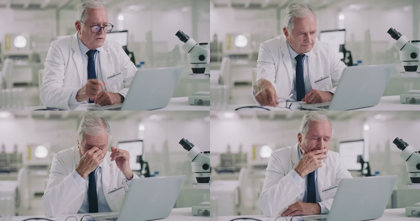 一位科学家在现代实验室里使用笔记本电脑，看起来很紧张的4k视频片段