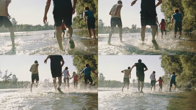 SLO MO一家三个孩子在河的浅水中奔跑