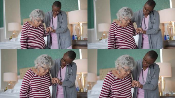 护士帮助一位站在卧室里的老年妇女