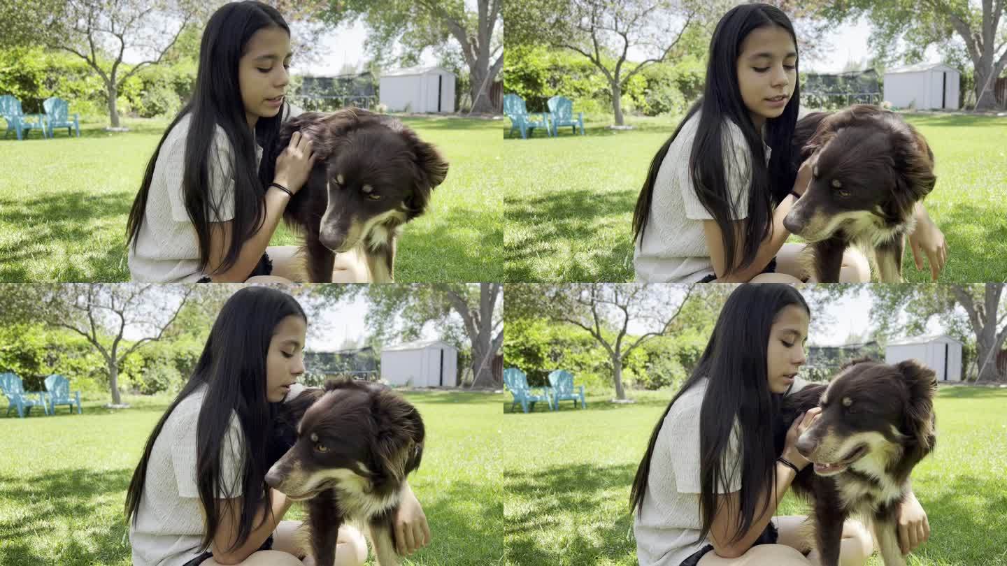 青少年女孩玩和给她的小狗爱