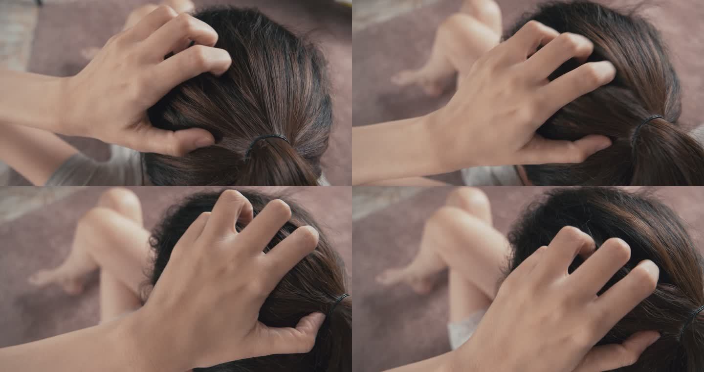 4k分辨率的亚洲女人发痒、抓挠头皮，头上的头发受损。美发概念