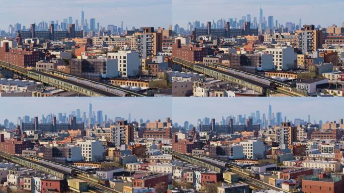 两列火车在纽约布鲁克林布什维克住宅区的高架地铁线路上相向而行，背景是曼哈顿下城的远景。具有向后平移相