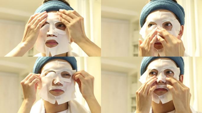 亚洲年轻男子使用面部护肤包
