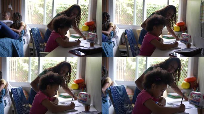 母亲帮助女儿在家学习