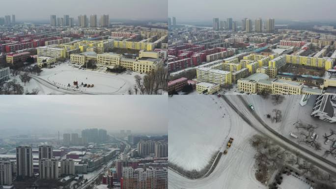 黑龙江齐齐哈尔小雪后的街道和清雪车