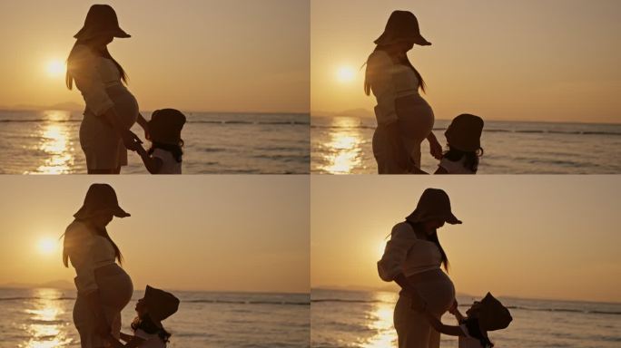日落时分，女儿在海滩亲吻怀孕母亲的腹部轮廓