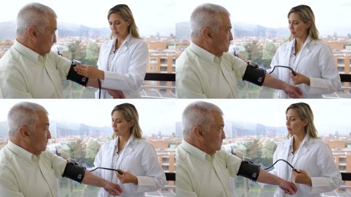 一名老年男子在医院接受女医生检查血压