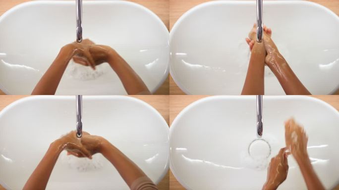 一个女人用肥皂洗手