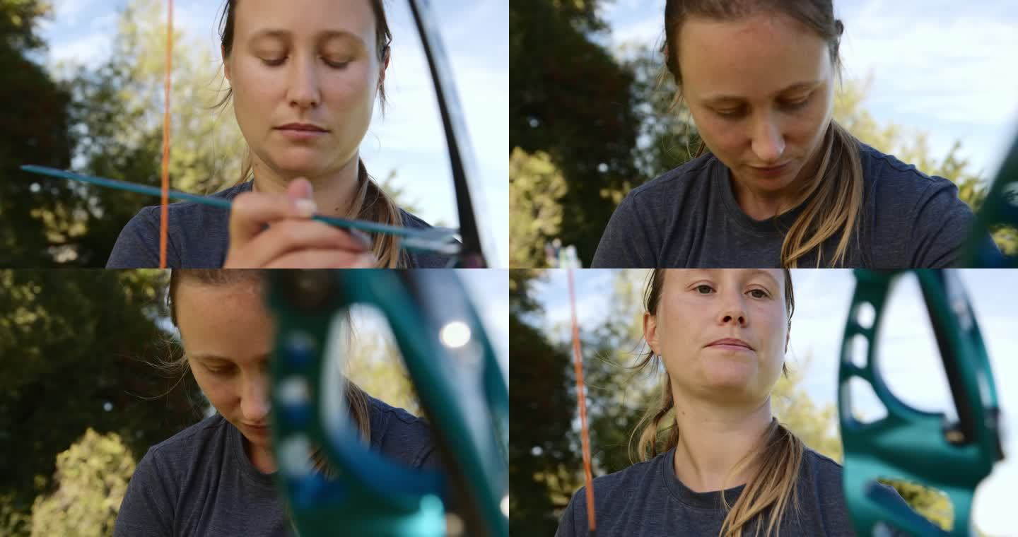 4k视频拍摄了一位年轻迷人的女射箭运动员在射箭场上练习技巧