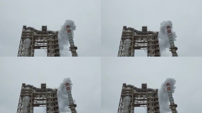 白色烟雾缭绕直升天空厂区高塔烟囱冒水蒸汽