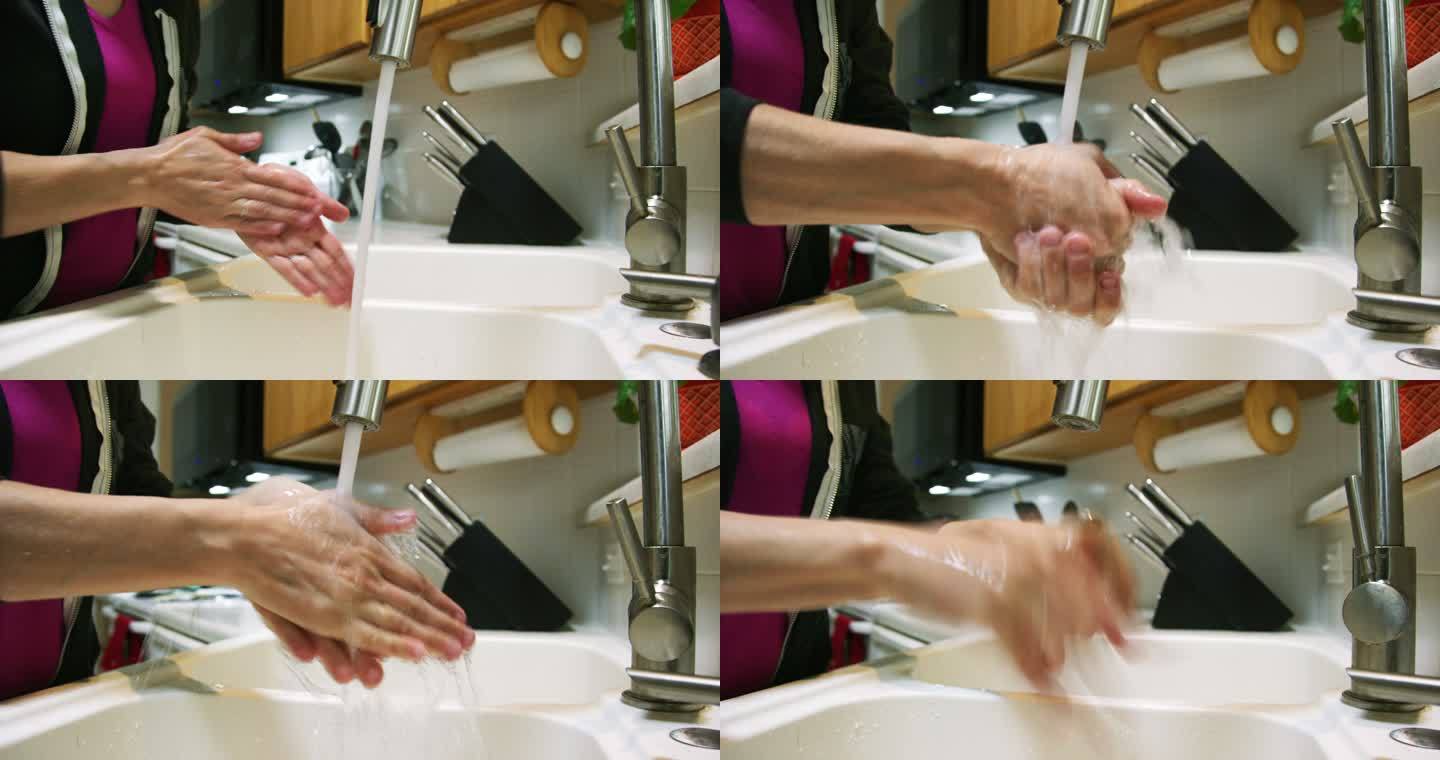 一位白人妇女在厨房洗手盆里用肥皂洗手时，双手打开水龙头，然后关闭水龙头