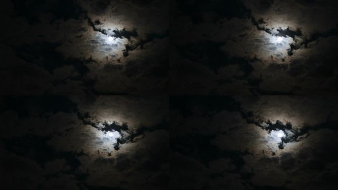 月光和多云的天空在夜晚飘荡。