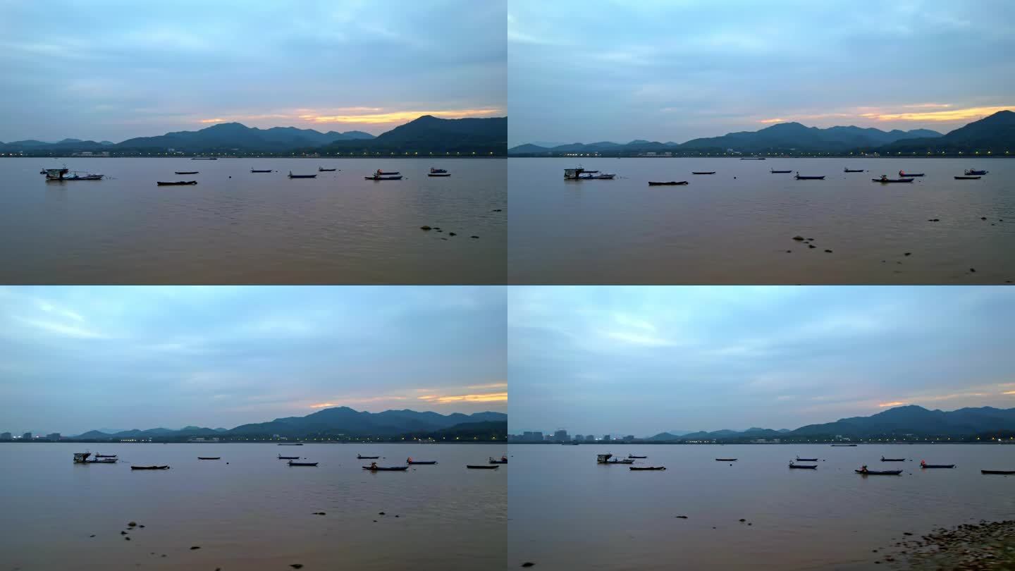 航拍杭州夕阳下的钱塘江渔船