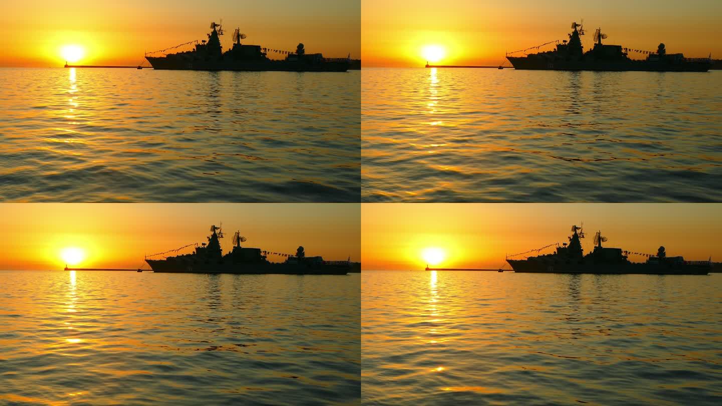 日落时分海湾里的军用船