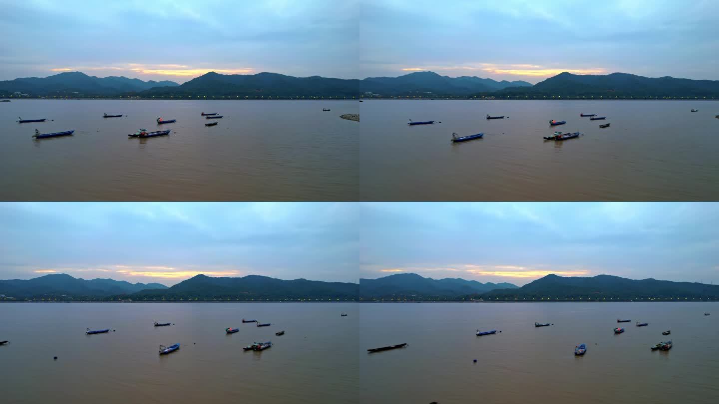 航拍杭州夕阳下的钱塘江渔船