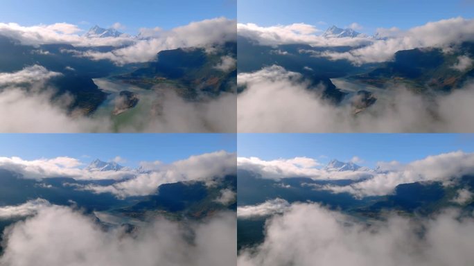 航拍西藏晴天云雾中的雪山和雅江