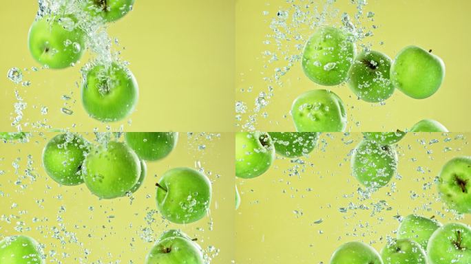 苹果在橄榄绿的背景下缓慢地落入清澈的水中。新鲜、多汁、美味的苹果掉进水中产生气泡的特写镜头。保持健康