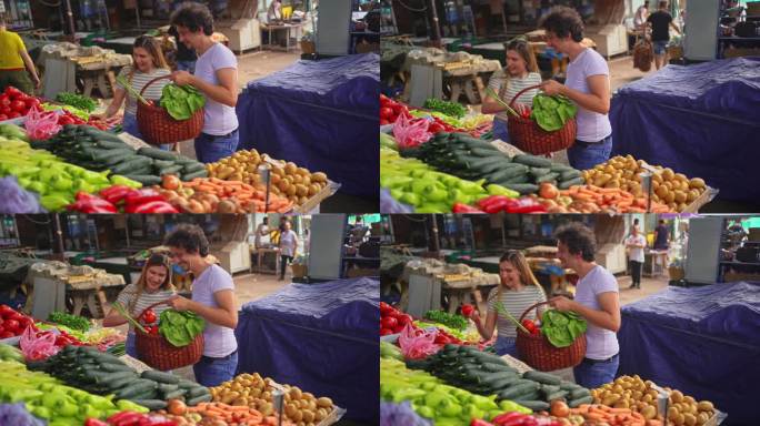 夫妇在公共市场买蔬菜