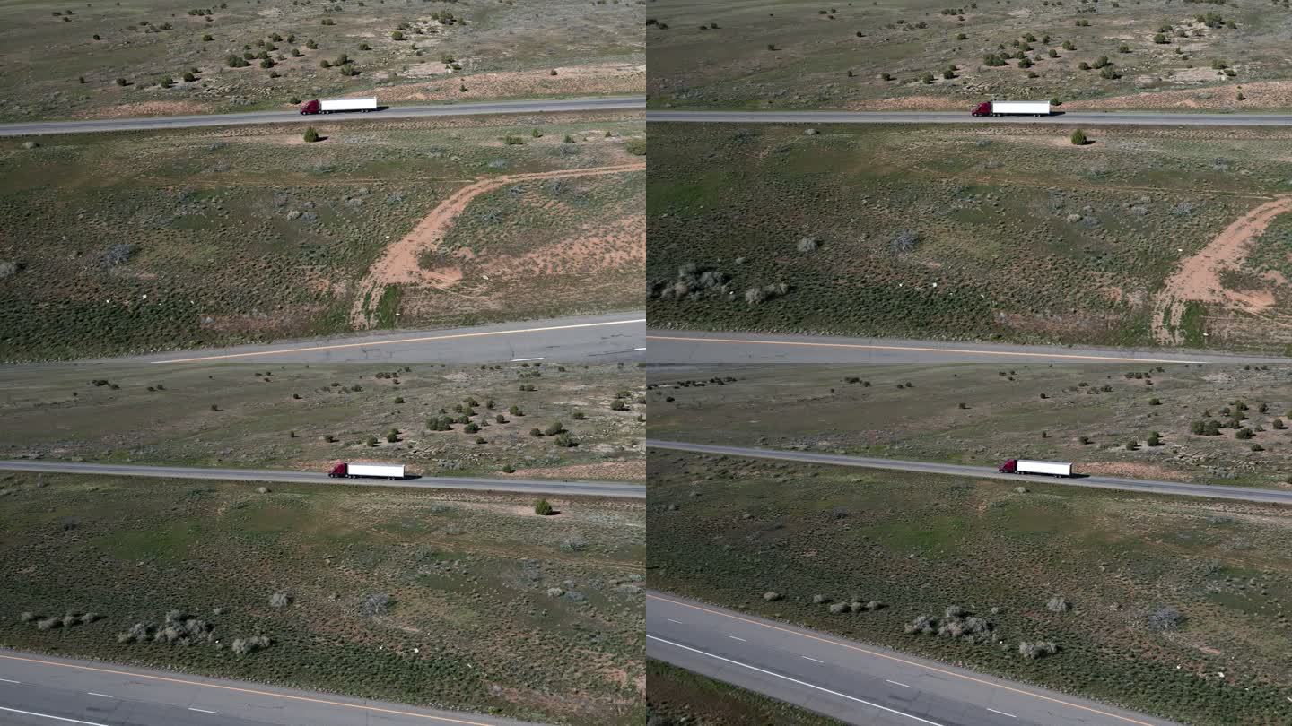 半卡车和汽车在犹他州和科罗拉多州之间的多车道公路上向东和向西行驶，空中无人机视频