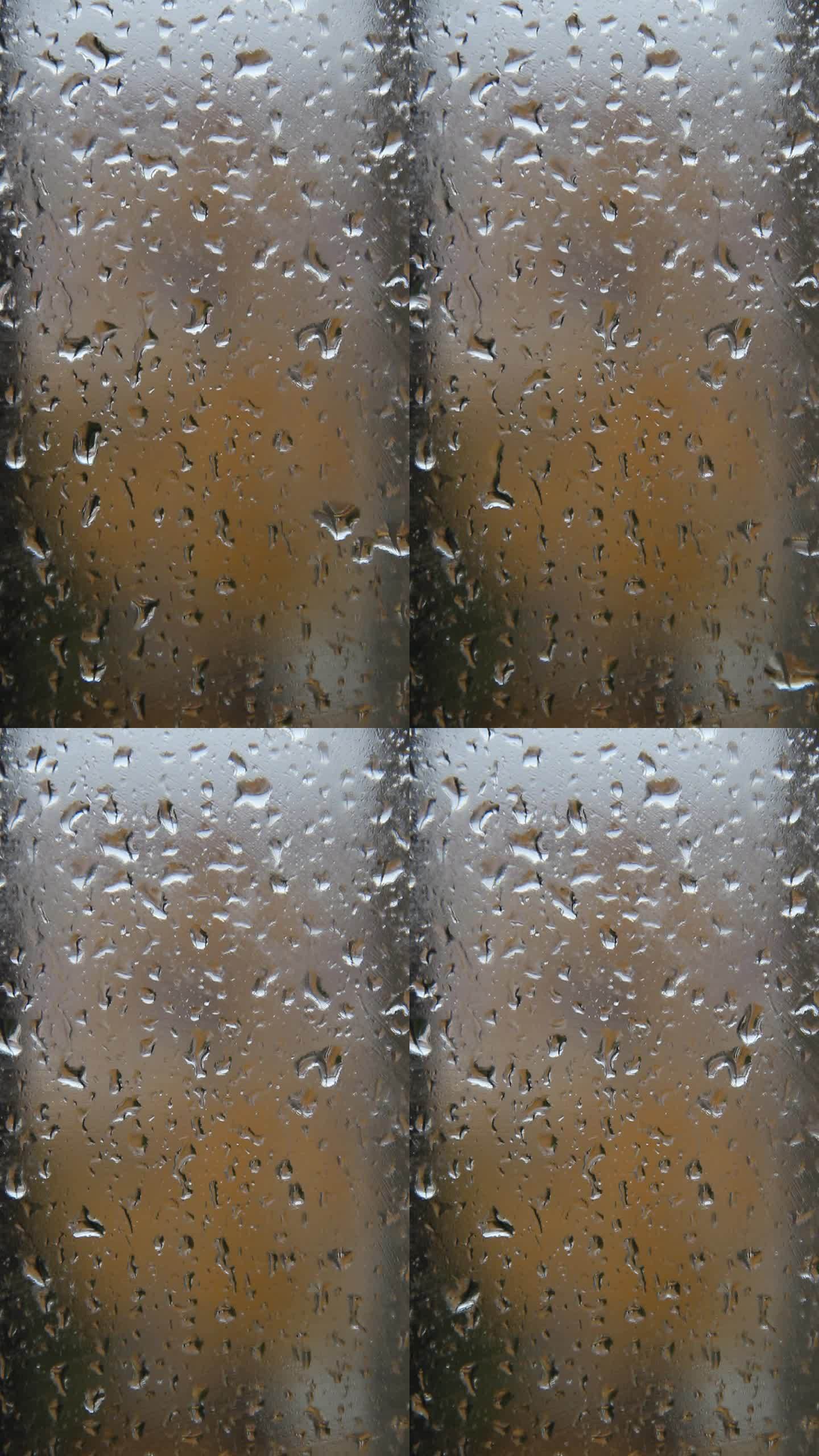 玻璃窗上的雨滴秋雨水滴窗户水珠