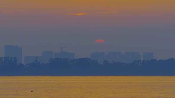 夕阳黄昏江边日落太阳下山城市日落夕阳夕下