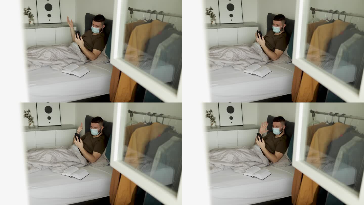 冠状病毒大流行期间，男子在床上视频通话