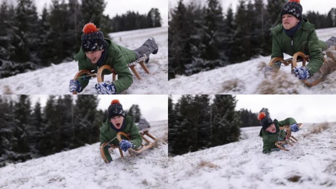 冬天的一天，小男孩在山上滑雪